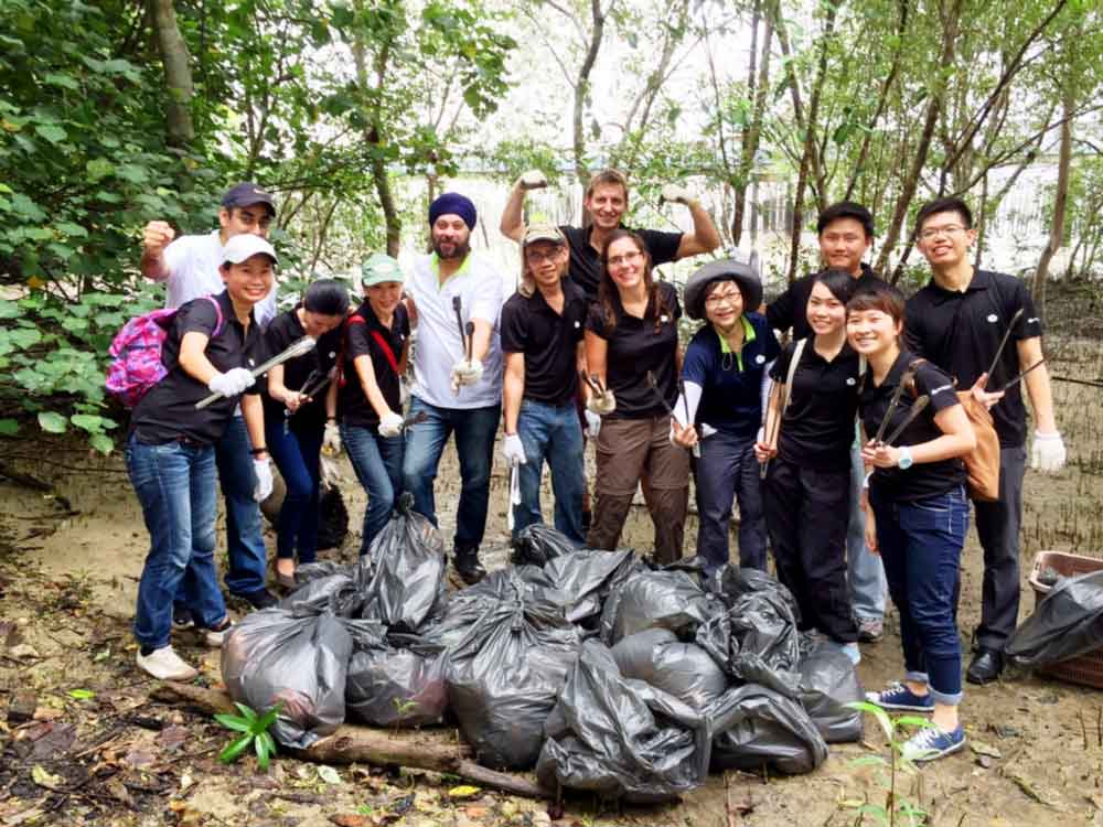 Berge Bulk volunteers with all the rubbish they cleared from the Mangrove.