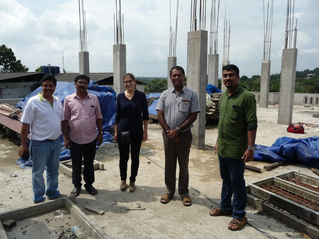 Berge Bulk volunteers standing at the construction site of the new building level