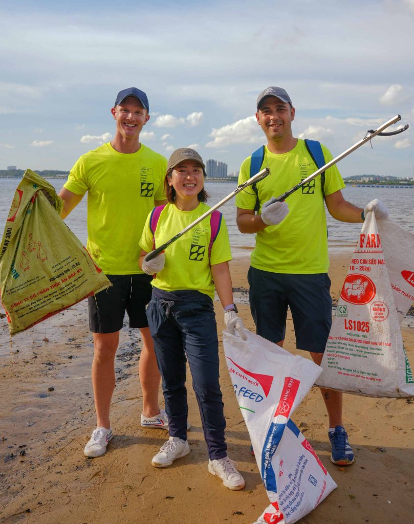 Volunteers from the Berge Bulk shore team clean up plastic from the Sembawang beach