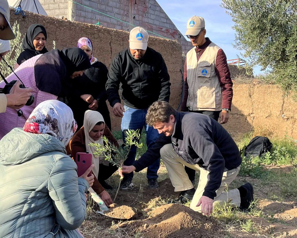 Peter Kenyon, from The Marshall Foundation, planting a fruit tree with The High Atlas Foundation in Morocco